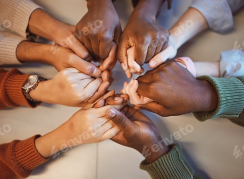 Preview: Holding hands, top view and group prayer of people with hope, support or faith, religion or spiritu