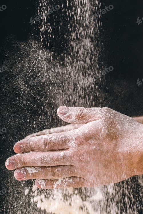 Preview: adult man hands work with flour, dark photo