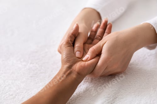 Preview: Acupuncture hand massage for black woman at spa