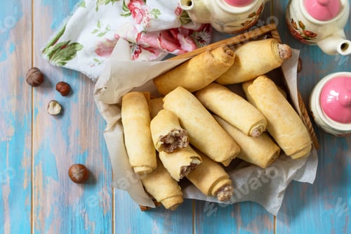 Preview: Homemade pastries. Crispy cookies with nut filling on a wooden table. Top view flat lay background.