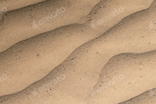 Preview: Beach shoreline featuring a rippled pattern in the sand