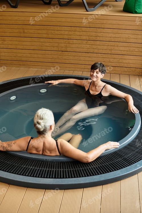 Preview: Bonding moments in wellness center with active senior women enjoying relaxation