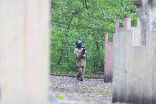 Preview: kids team play paintball on the field
