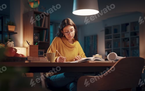 Preview: Young woman studying late at night