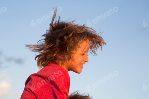 Preview: smiling 5 year old boy at sunset on the beach, Georgia
