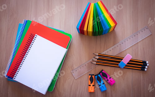Preview: Group of school supplies and books over a desk, student accessories, teacher's day