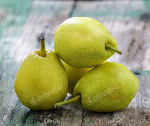Preview: Green pears on a rustic wooden