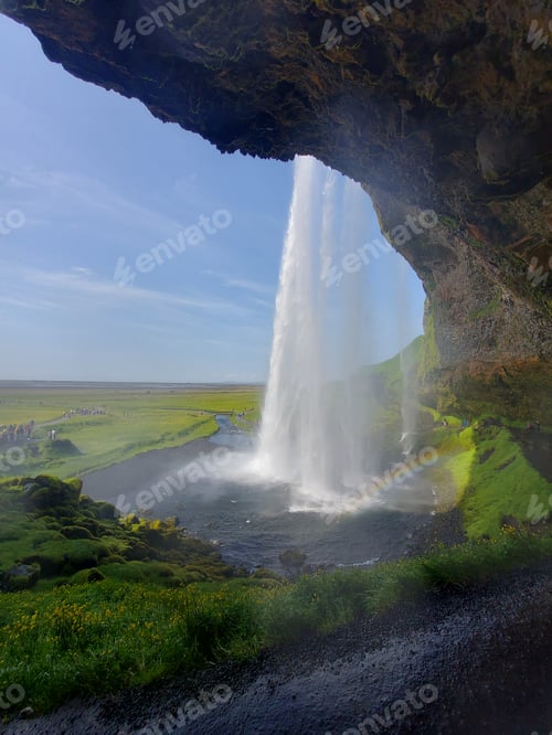 Preview: Open cave with a waterfall spraying out of the side. Iceland