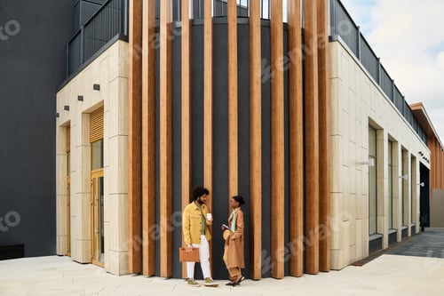 Preview: Conversing Outside Modern Architectural Building