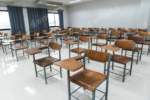 Preview: School classroom with many wooden chairs well-arranged in rows with no student
