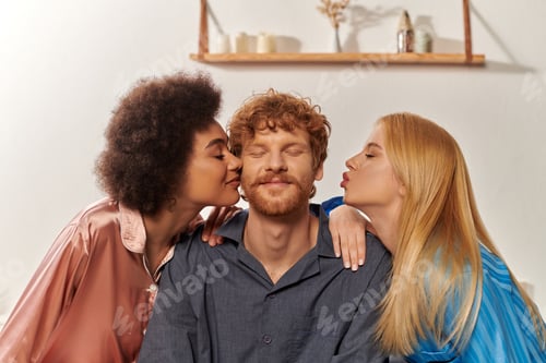 Preview: polygamy concept, open relationship, portrait of three adults, multicultural women kissing happy