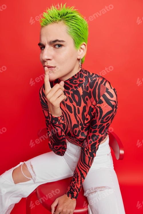 Preview: Attentive serious punk teenager has own style of clothes and appearance explores social options expe