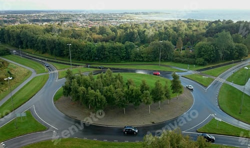 Preview: Roundabout with yin yang sign in the middle, traffic, cars, commute, view, green, daily life, road