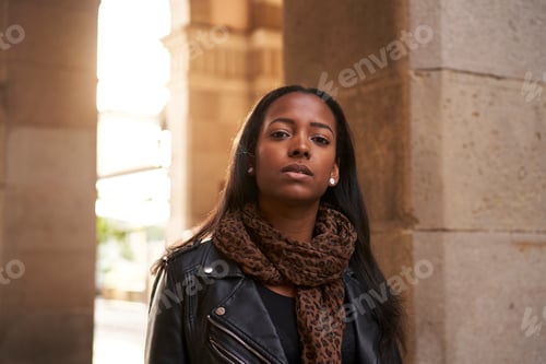 Preview: Portrait of young beautiful African American woman looking at camera with serious face