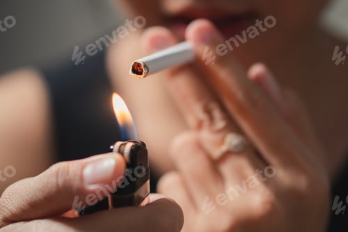 Preview: Smoker lighting a cigarette with lighter