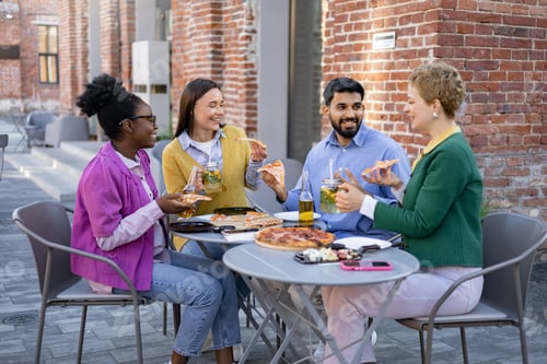 Preview: Friends Sharing Pizza Outdoors