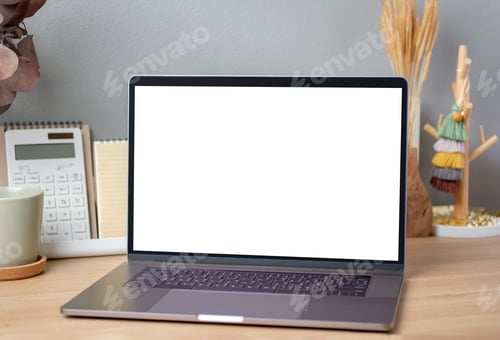 Preview: Blank screen laptop on working desk decor with stationery at home