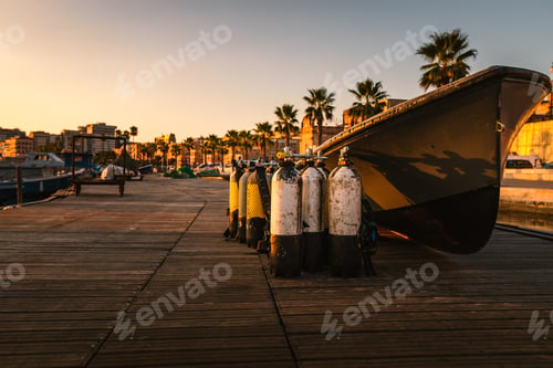 Preview: Oxygen cylinders for divers in the port of Taranto Vecchia at dawn