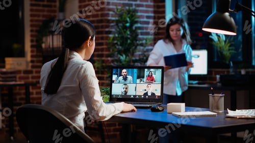 Preview: Manager organizing company meeting on videocall, discussing with employees