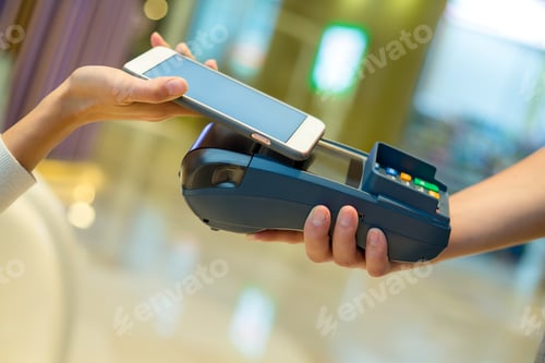 Preview: Woman use of mobile phone to pay