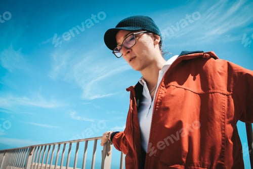 Preview: Young woman against blue sky in Valletta