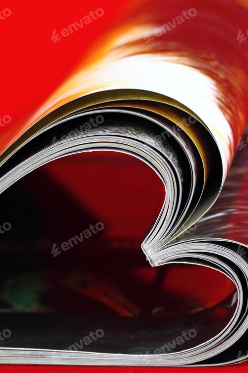 Preview: Selective focus image of magazine folded into a heart shape