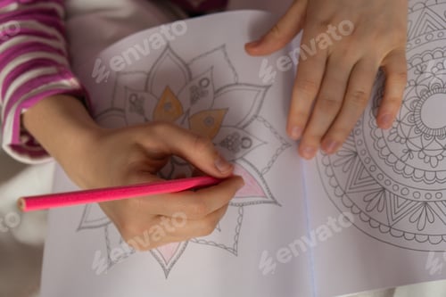 Preview: Female painting mandalas antistress page to combat stress. Relaxing hobby mental wellbeing and art