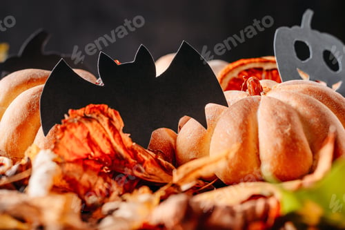 Preview: Homemade halloween cakes in the shape of pumpkin on dark background