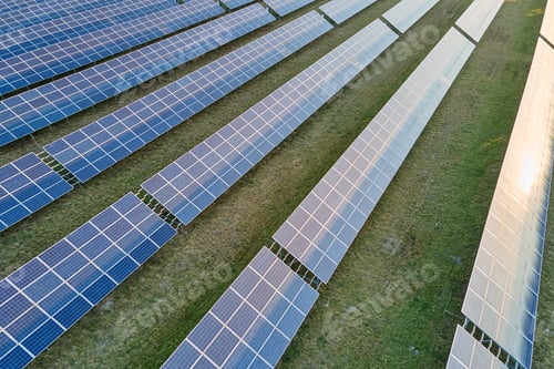 Preview: Aerial view of large sustainable electrical power plant with rows of solar photovoltaic panels