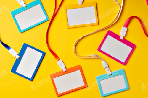 Preview: Colored blank nametags on strings on yellow background