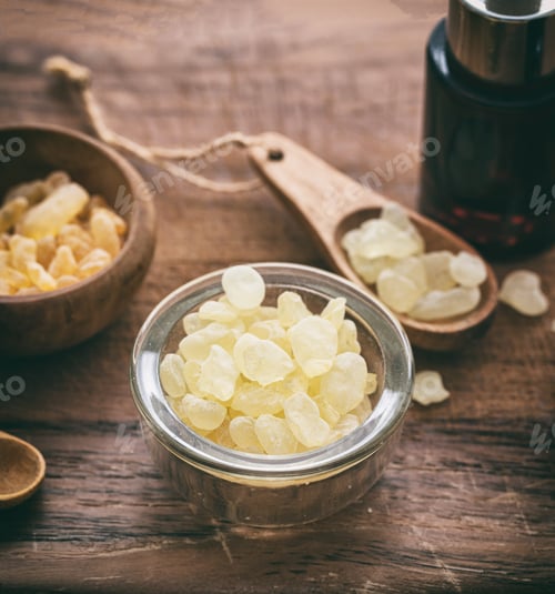 Preview: Chios mastic tears on wooden background, closeup view