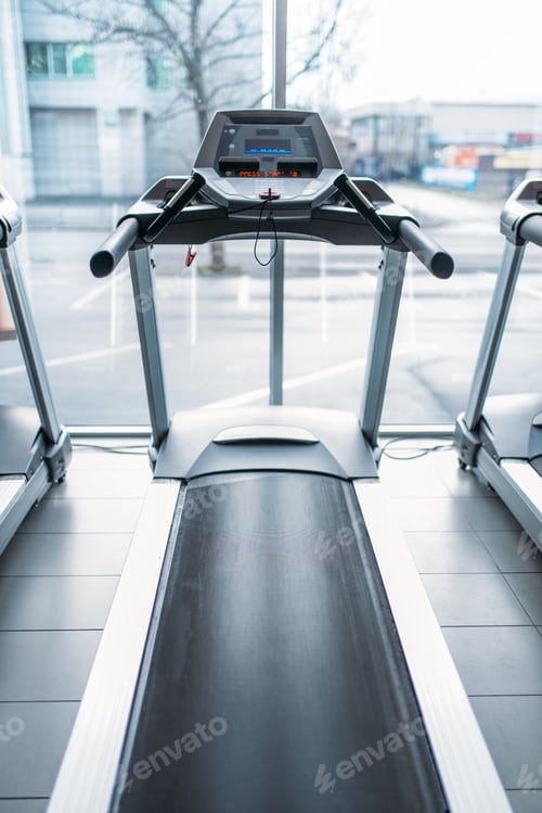 Preview: Treadmill against big window, gym interior, nobody