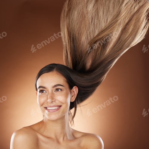 Preview: Hair, beauty and skincare with a model woman in studio on a brown background for natural or keratin