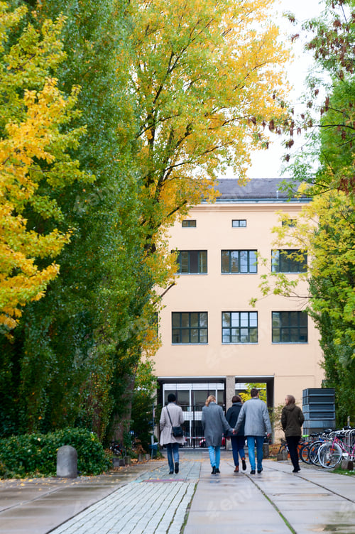 Preview: A group of friends including a young couple are walking in a university campus.