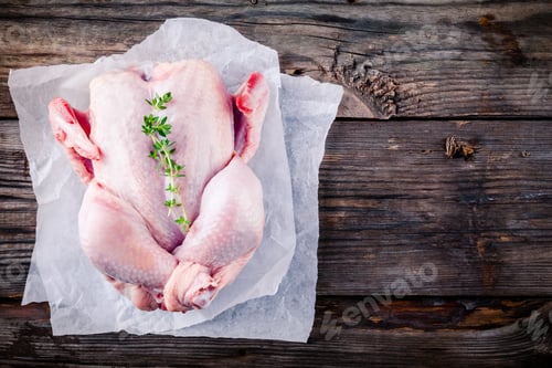 Preview: organic raw whole chicken on wooden background