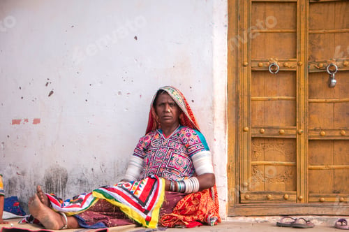 Preview: Tribal woman working her traditional handicrafts by embroidering colorful thread., india