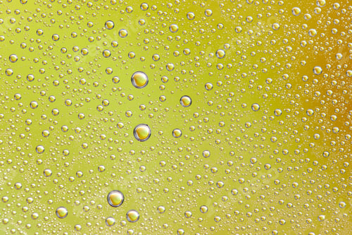 Preview: Drops on glass of different sizes and colors on a colored background, texture