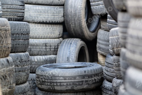 Preview: Old used rubber tires stacked with high piles. Hazardous waste requiring recycling and disposal.