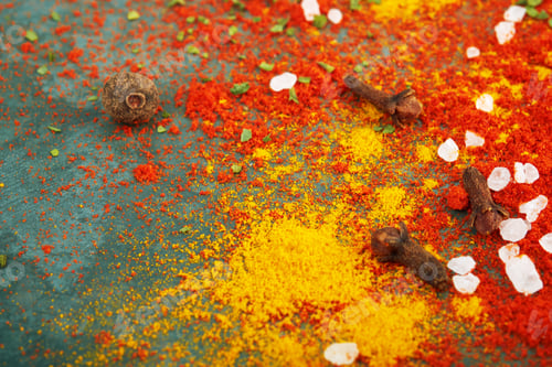 Preview: Different spices scattered on the table, red paprika powder, turmeric, salt, cloves, pepper