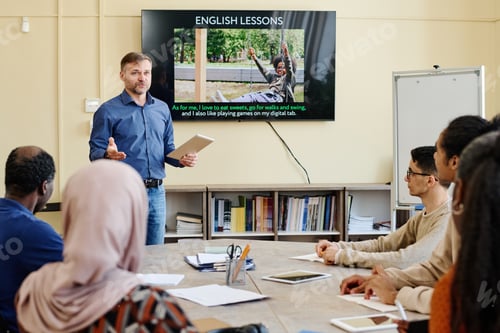 Preview: Mature Teacher Working With Immigrants