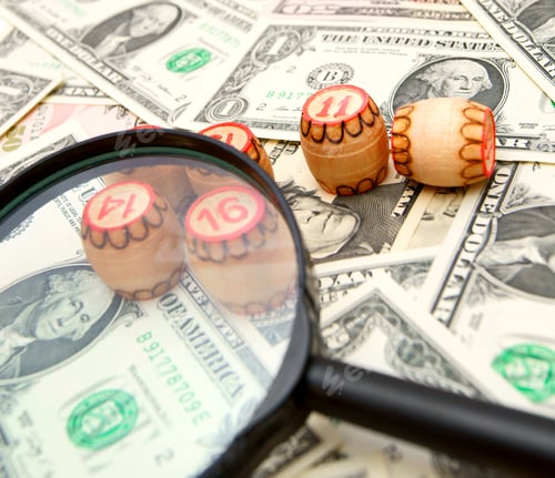 Preview: Magnifier and lotto on banknotes (dollars).