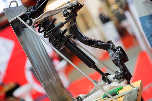 Preview: Car Suspension Component with Black Spring and Shiny Metal