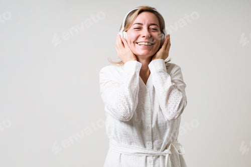 Preview: Attractive older woman singing and laughing