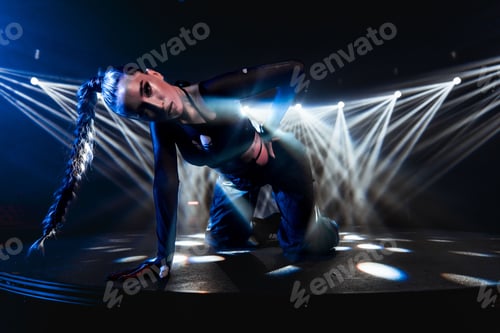 Preview: Attractive woman posing on a club stage with neon lights in the background