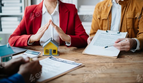 Preview: Female real estate agent is use hands to protect red roof for the concept of real estate investment