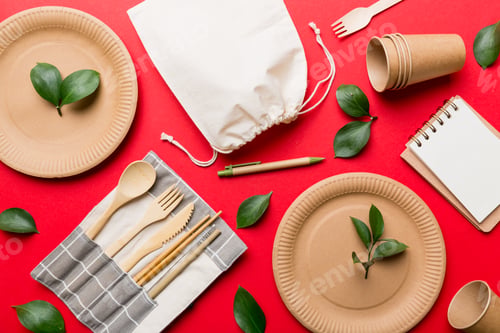 Preview: set of empty reusable disposable eco-friendly plates, cups, utensils on light white colored