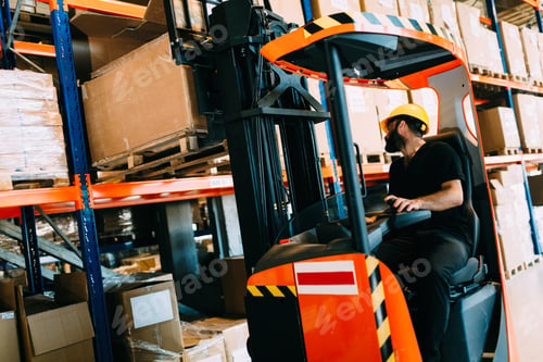 Preview: Warehouse worker doing logistics work with forklift loader