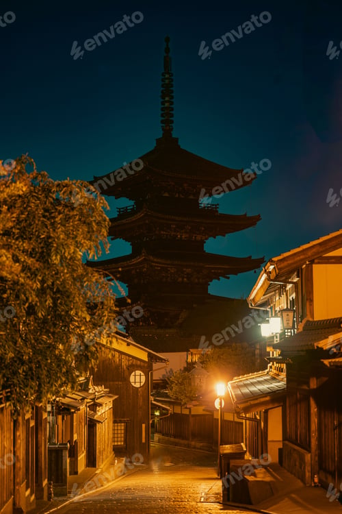 Preview: Beautiful dawn of Kiyomizu-dera Temple in Kyoto, Japan, with lush green trees and a clear sky.