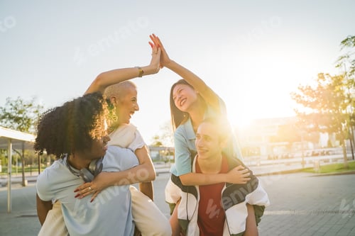 Preview: Friends riding on top of each other happily high five and celebrating joyfully