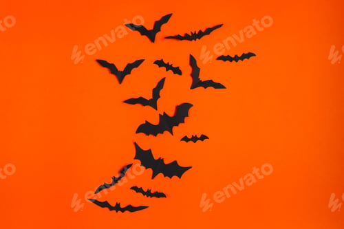 Preview: Happy Halloween. Paper bats on orange background.
